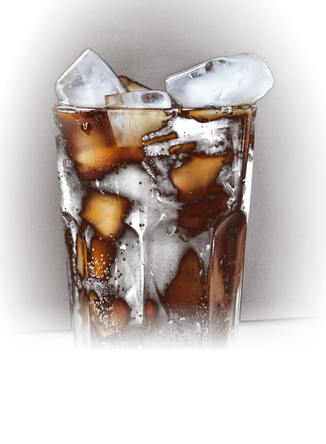 A glass of cola over ice