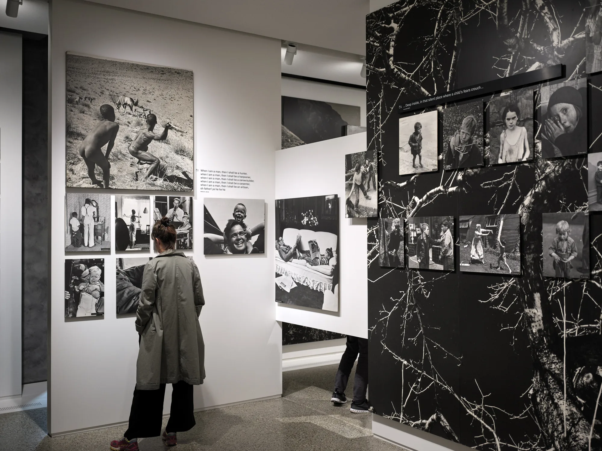 A visitor in The Family of Man exhibition in Clervaux